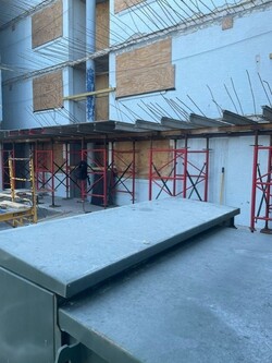 The forms are being established on the first floor. You can see the iron beams, rebar, new rebar, and electrical and plumbing that will go through this floor. It will take about three weeks after that it move much faster.