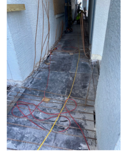 2nd floor walkway formwork and in-progress drilling for dowels